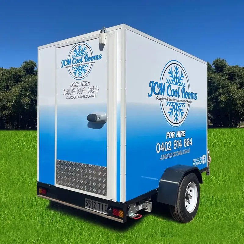 Adelaide Secures MotoGP blog - image of a JCM Cool Room Mobile cool room sitting on a grassy area with trees and blue sky in the background.